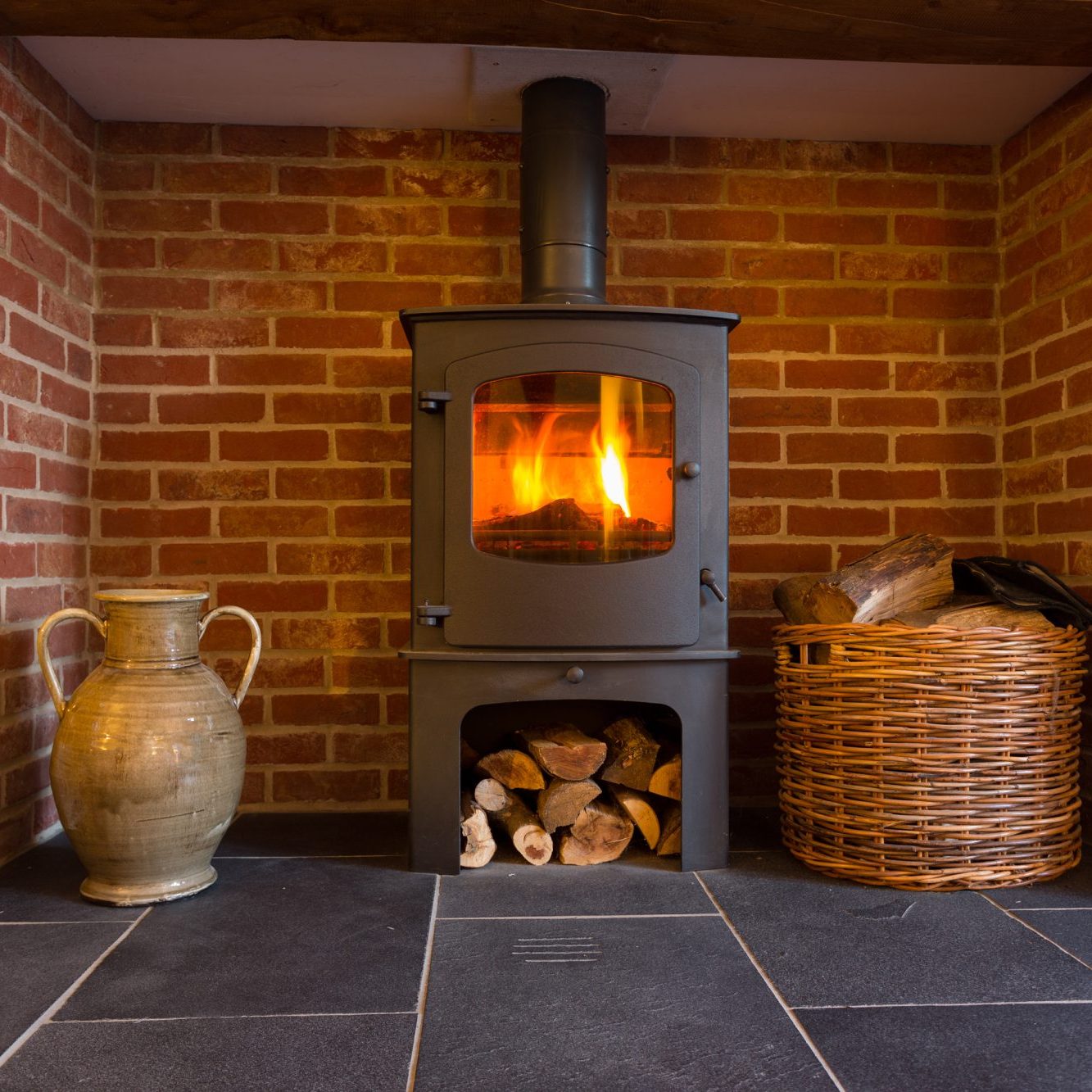 Wood burning stove in brick fireplace Stove Service